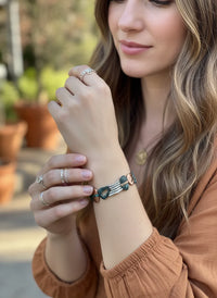 Earthy patina mixed metal bracelet with green and white beads and gold accents