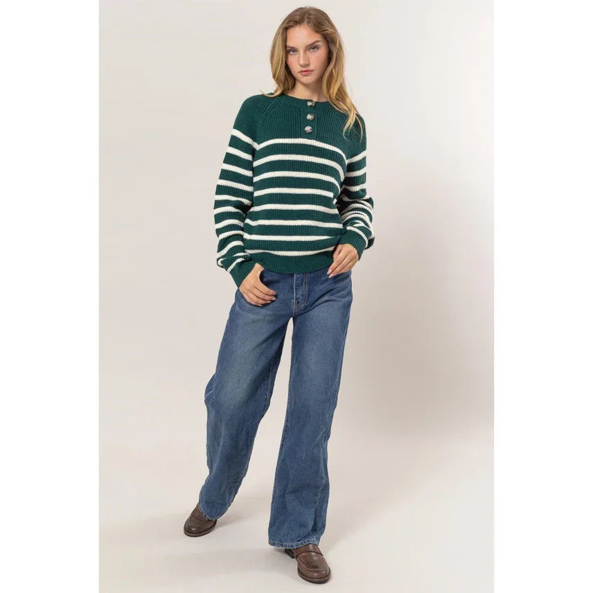 Green and white striped Henley sweater paired with blue wide-leg jeans, shop Daisy’s women’s boho chic clothing