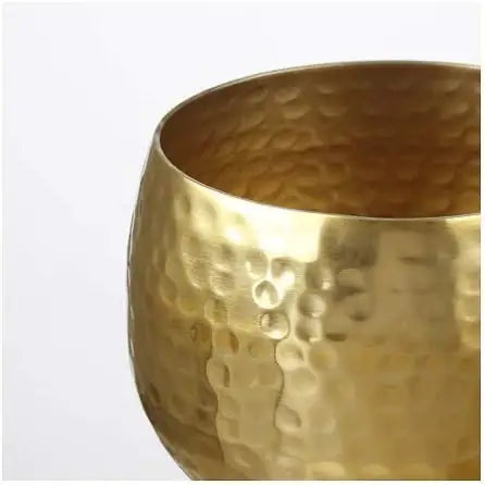 Hammered gold aluminum decorative bowl with a dimpled texture and tinted clear lacquer finish