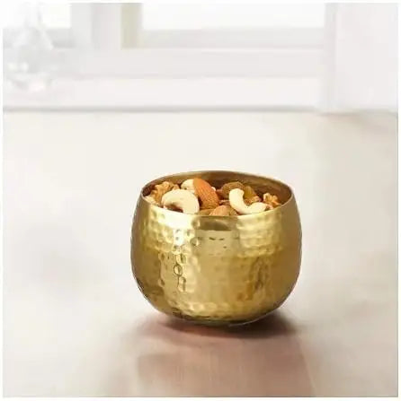 Hammered gold aluminum decorative bowl with mixed nuts coated in tinted clear lacquer