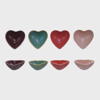 Heart shaped stoneware dishes in burgundy, teal, red, and pink colors