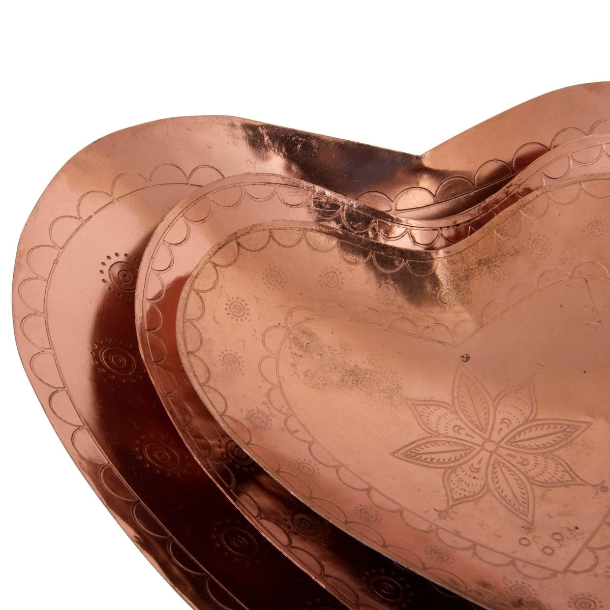 Decorative embossed copper heart-shaped trays with floral patterns