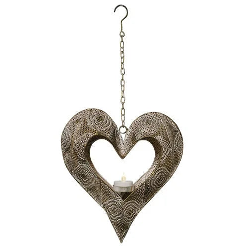 Heart-shaped metal tea light holder with swirling patterns, suspended by a chain