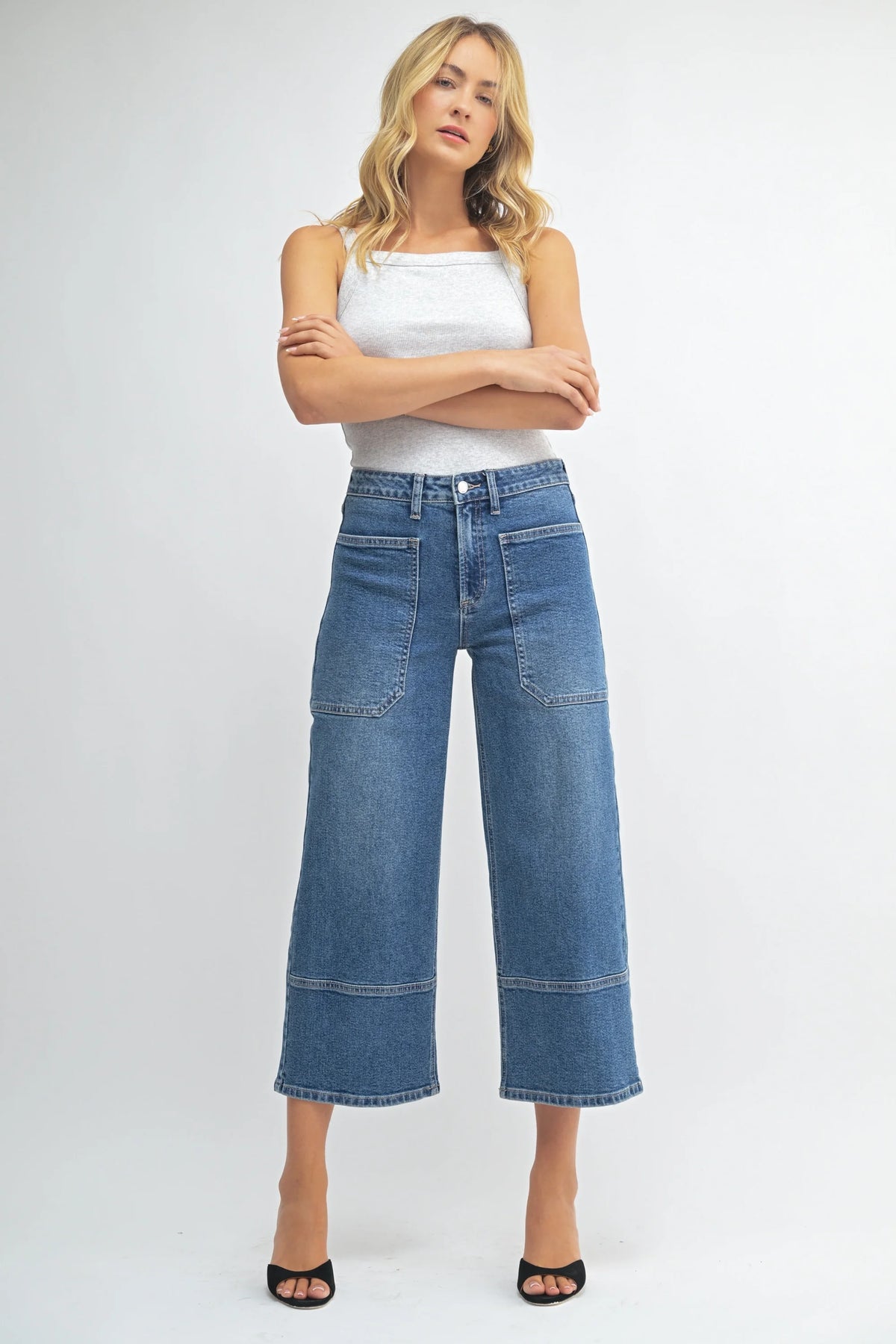 High rise cropped wide leg denim jeans in blue with distressed details