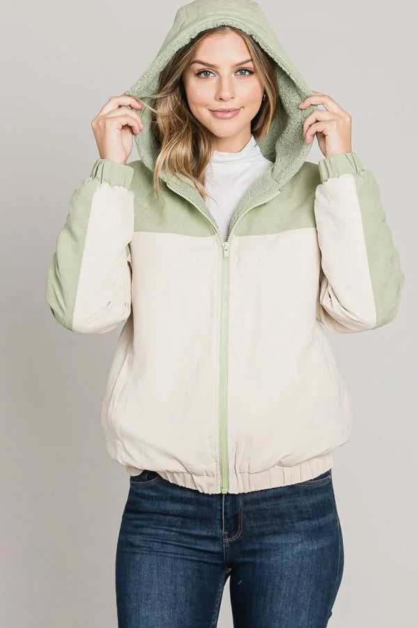 Woman wearing Soft Brushed Matte Woven Hoodie Jacket with light green hood and white body