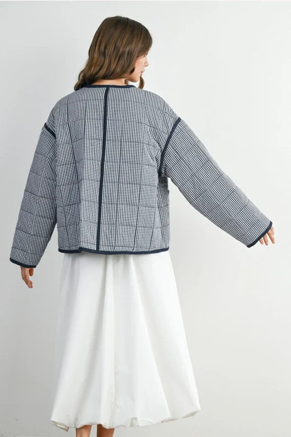 Buttoned quilted puffer jacket with houndstooth pattern