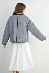 Buttoned quilted puffer jacket with houndstooth pattern