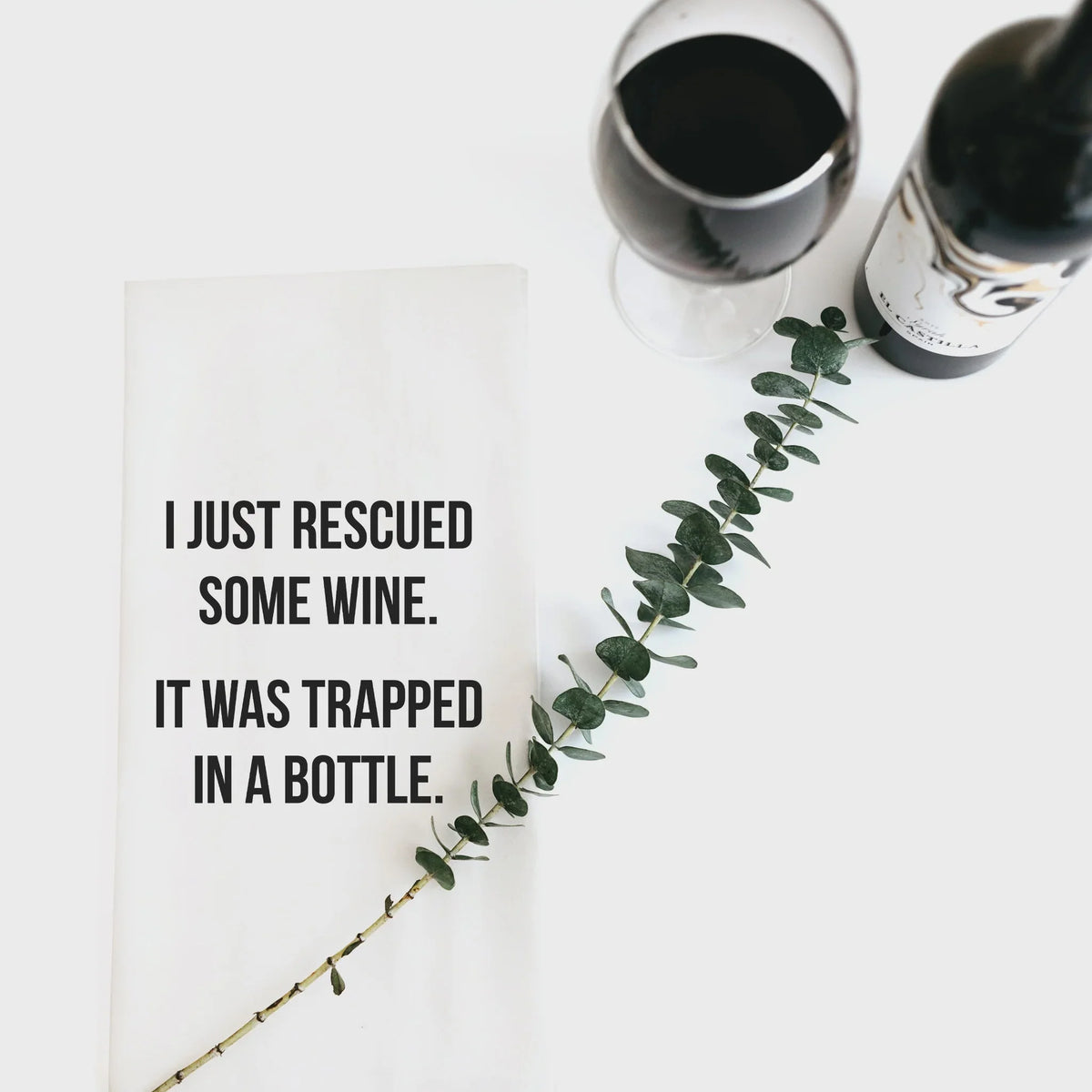 Humorous rescued wine note on a tea towel with a wine glass and bottle design