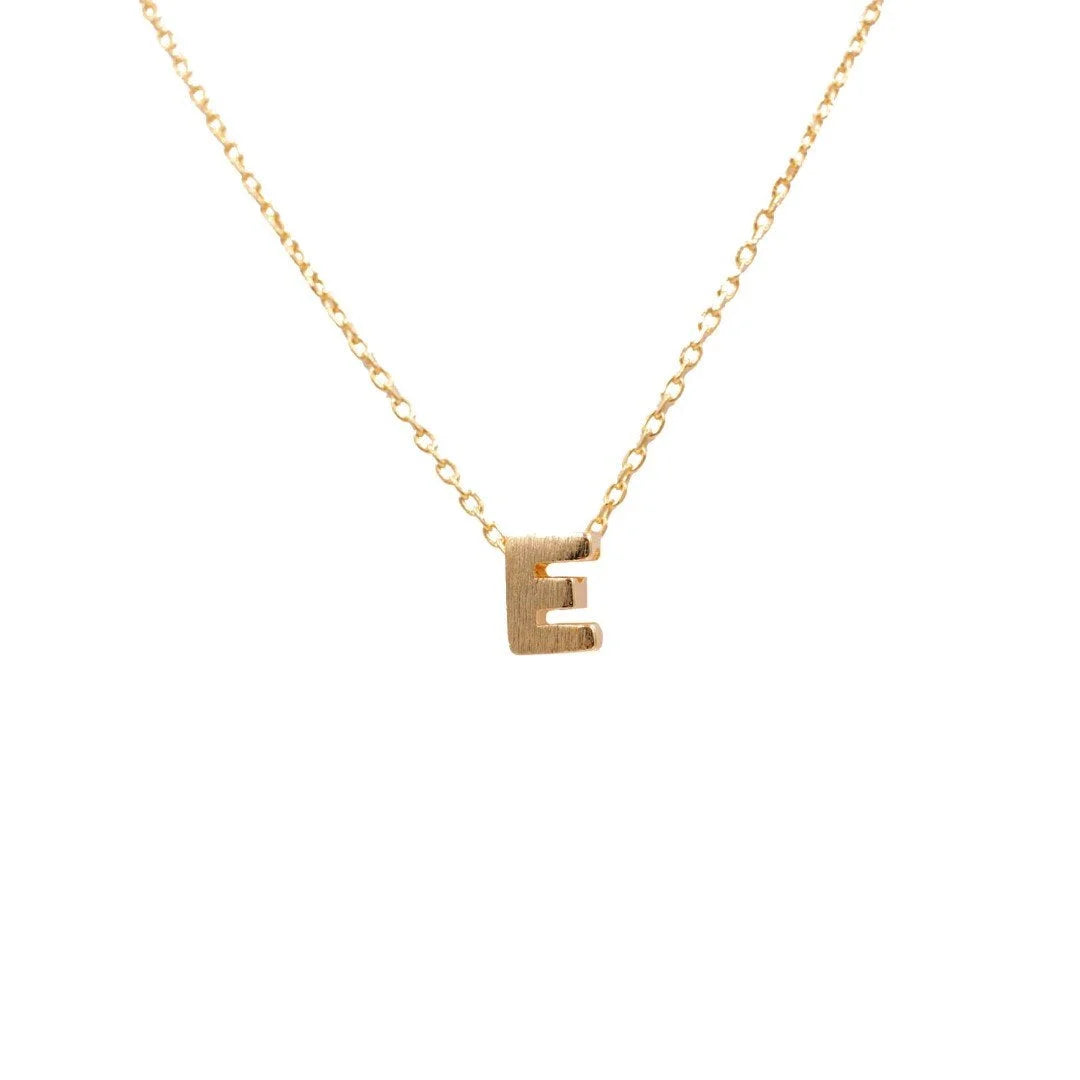 Dainty Initial Necklace in Gold from Daisy Lane featuring an elegant initial E design