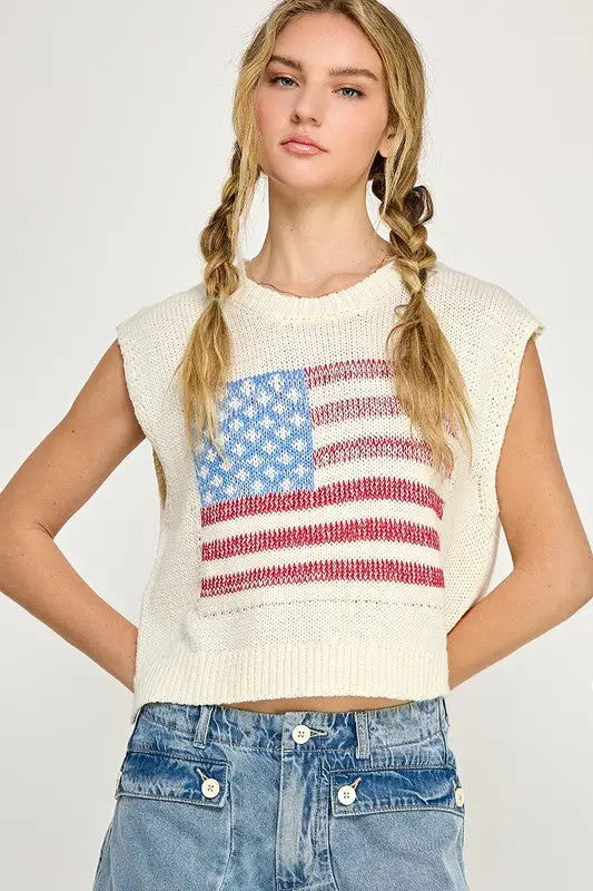 Woman wearing a knit pullover sweater vest featuring the American flag design