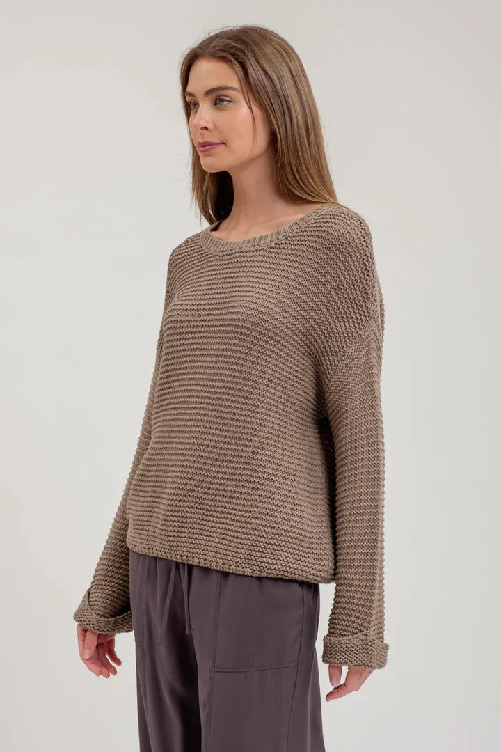 Chunky knit long sleeve pullover sweater with wide neckline and loose-fitting sleeves