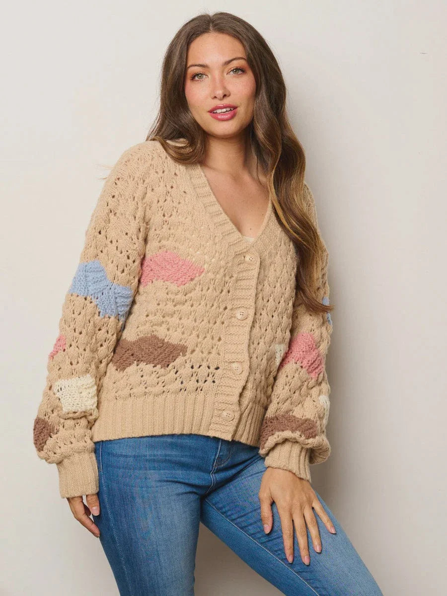 Knitted beige sweater with pastel striped sleeves from Shop Daisy women’s boho chic clothing