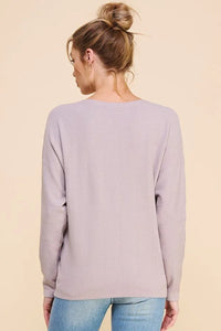 Lavender crewneck sweater with long sleeves featuring a soft chevron pattern fine gauge design