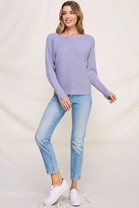 Lavender knit sweater featuring a boat neckline, ribbed texture, fine gauge pullover design