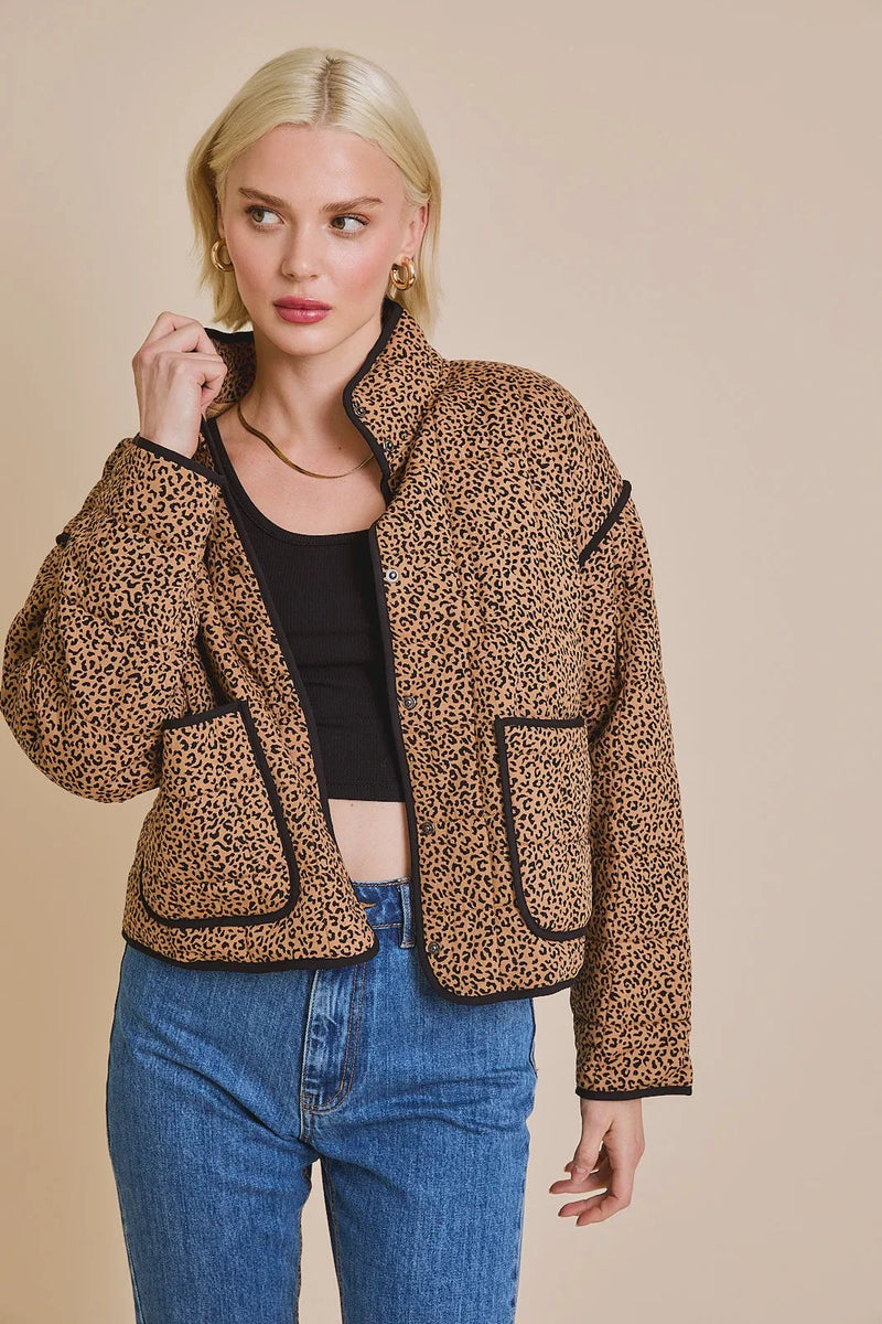 Leopard print fleece drop shoulder animal print jacket styled with blue jeans and a crop top