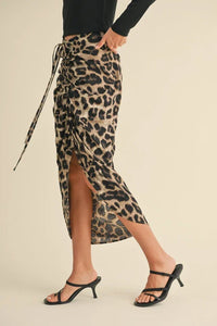 Leopard-print midi skirt with side slit and wrap-style tie featuring print ruching detail