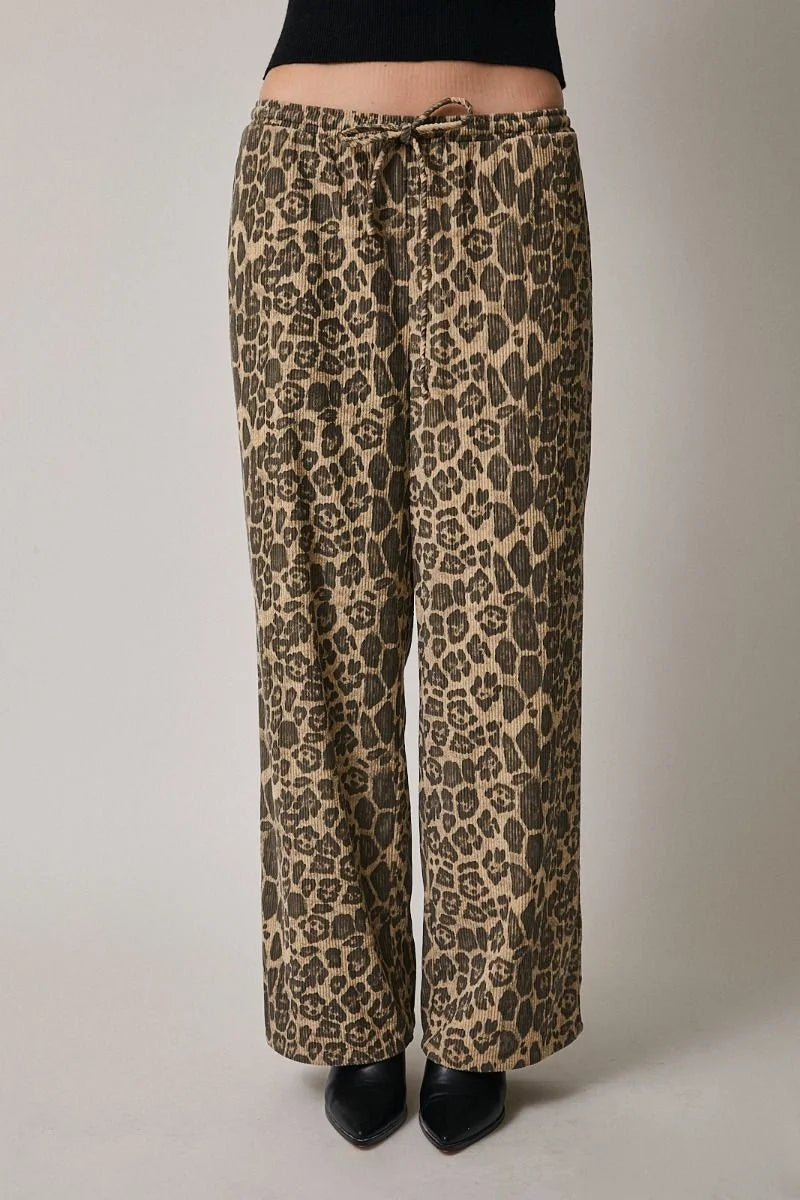 Leopard print draw string waist pants with black heels and top
