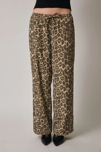 Leopard print draw string waist pants with black heels and top