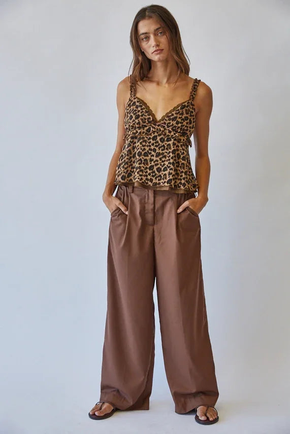 Leopard print lace ruffle cami with peplum design paired with brown wide-leg trousers