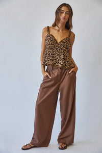 Leopard print lace ruffle cami with peplum design paired with brown wide-leg trousers