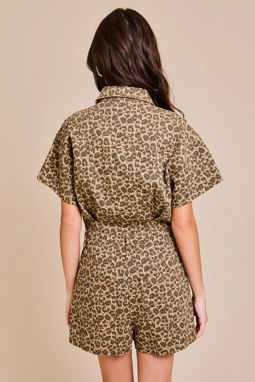 Back view of short sleeve leopard print denim romper showcasing stylish design