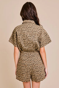 Back view of short sleeve leopard print denim romper showcasing stylish design