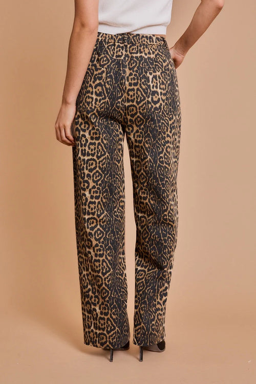 Leopard print wide-leg trousers showcased from the back, featuring stylish leopard twill