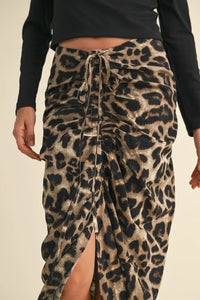 Leopard print ruching detail skirt featuring a front tie and stylish slit