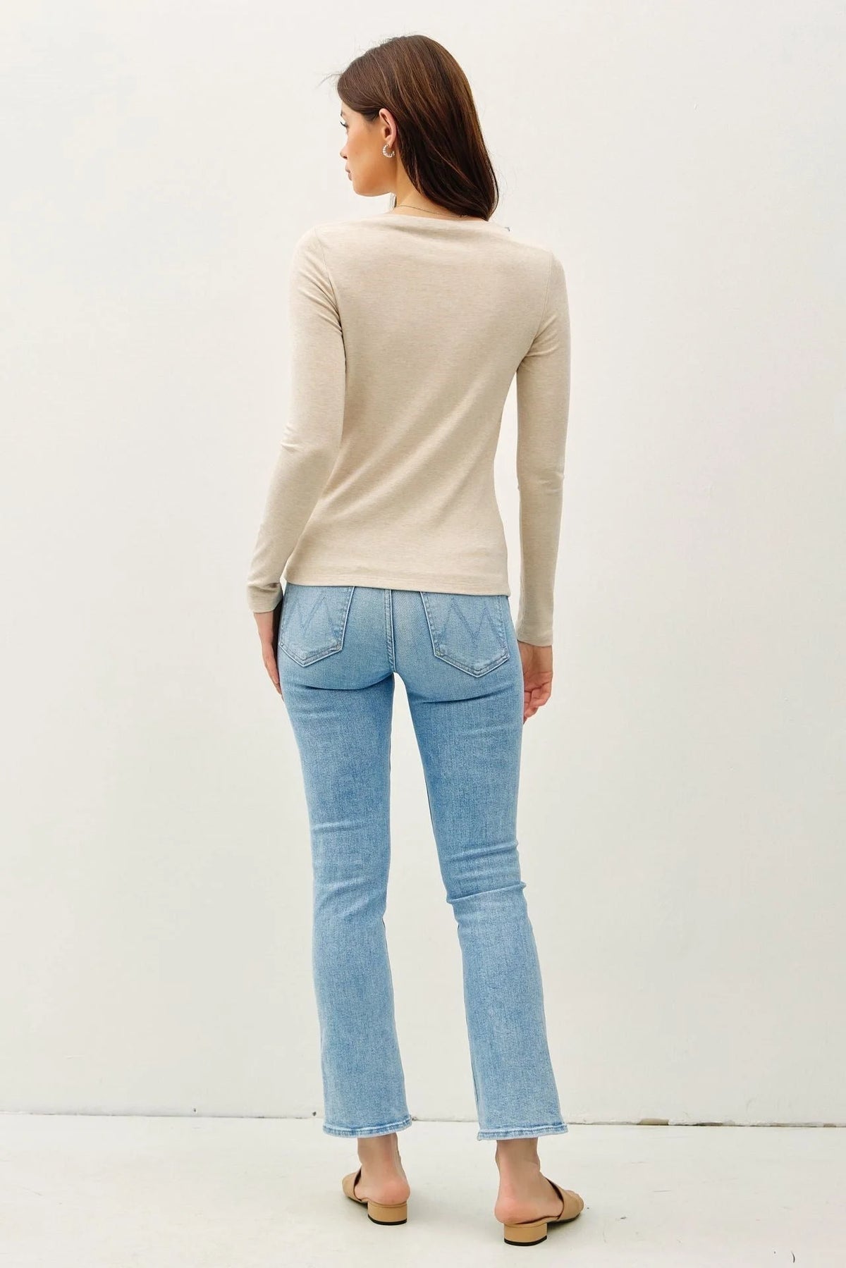 Light beige long sleeve knit top with basic boat neck and fitted silhouette