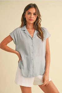 Light blue BUTTON DOWN CAP SLEEVE SHIRT, a flattering cap sleeve shirt for stylish outfits