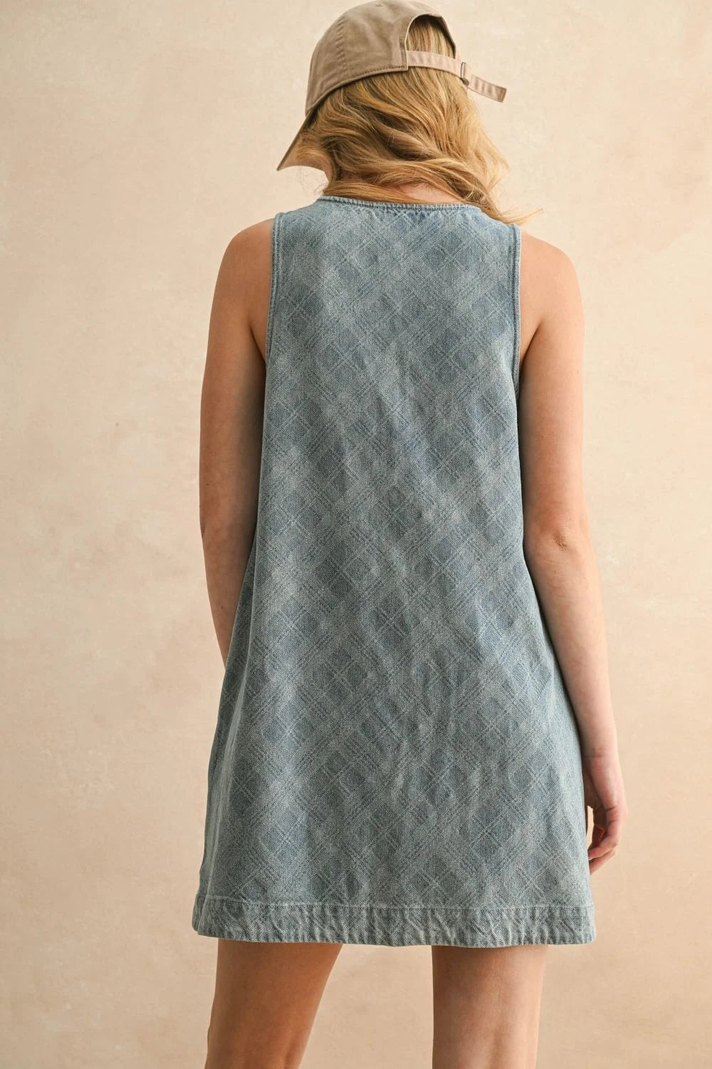 Light blue jacquard denim button front dress with subtle diamond pattern, back view
