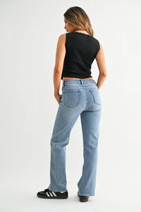 Mid rise straight leg denim jean in light blue with relaxed fit and high waist