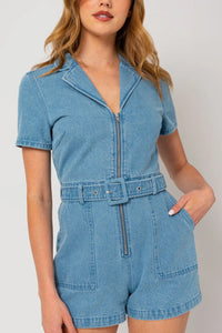 Light blue short sleeve denim romper with front zipper and belted waist for boho style