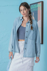 Light blue solid denim shacket over gray crop top, ideal for women’s boho chic clothing