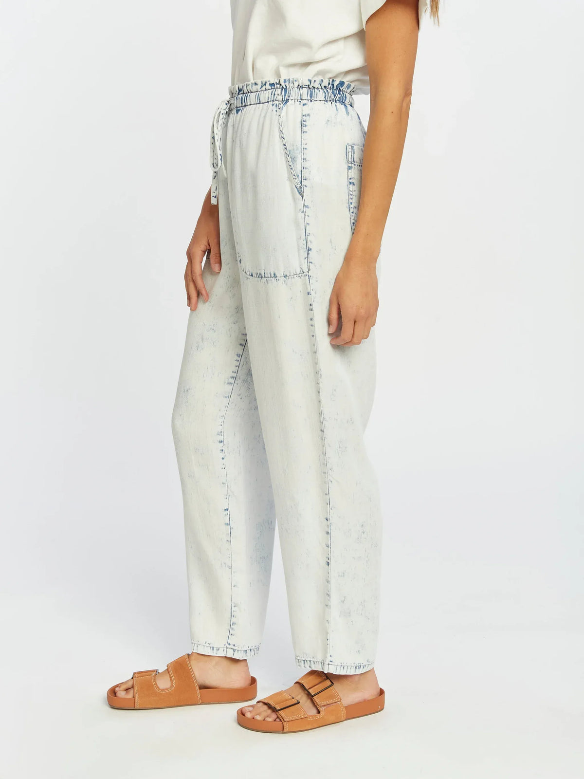 Light blue distressed Thread and Supply Nellie Pants with brown leather sandals