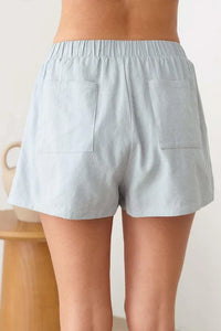 Light blue elastic waist line shorts with a relaxed fit and stripe pattern design