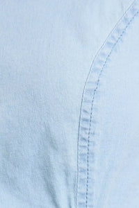 Light blue sleeveless fabric with detailed stitching on bubble hem denim top