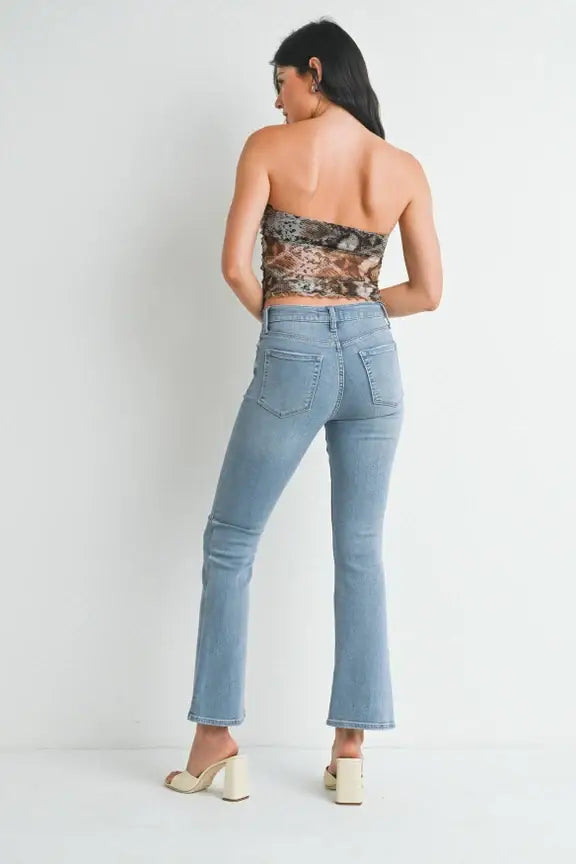 Light blue flared Petite Bootcut Denim Jeans paired with a cropped top from Shop Daisy