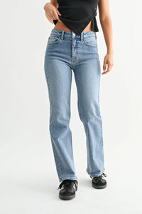 Mid rise straight leg denim jean in light blue with distressed details