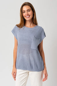 Light blue knitted sweater with pouch pocket, ideal for women’s boho chic clothing