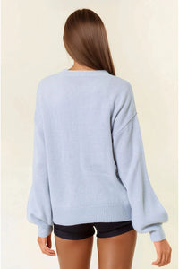 Light blue oversized sweater with gathered cuffs and ribbed hem, fall letter embroidered design