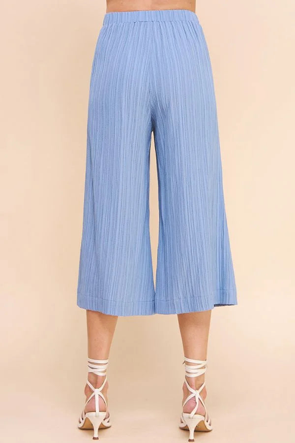 Light blue bamboo textured cropped flowy pants with pleated wide-leg design