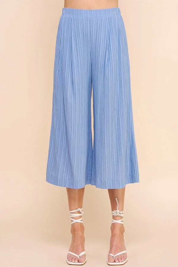 Light blue bamboo textured cropped flowy pants with a stylish wide-leg design