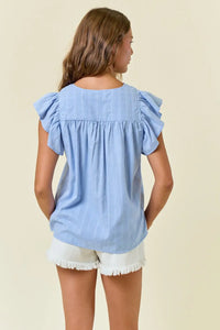 Light blue ruffled-sleeve blouse from Shop Daisy, perfect for women’s boho chic clothing
