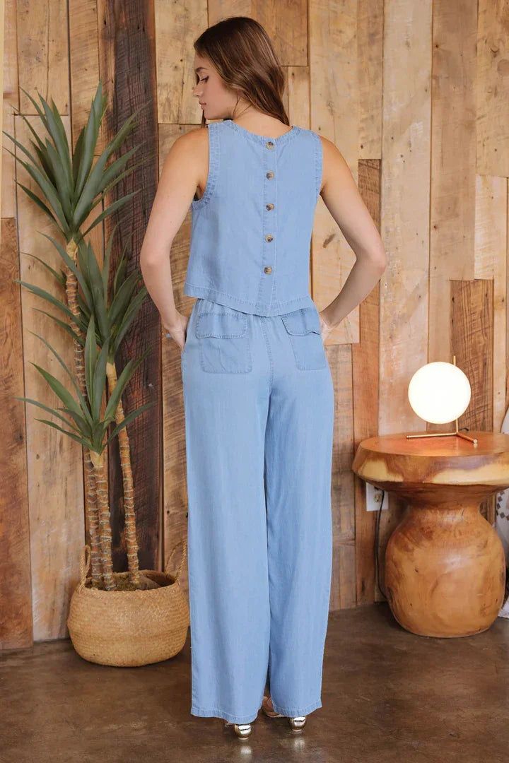 Light blue sleeveless jumpsuit with button details, perfect for a boho free spirit