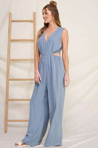 Light blue pinstriped linen V-neck jumpsuit with wide-leg pants for a boho look