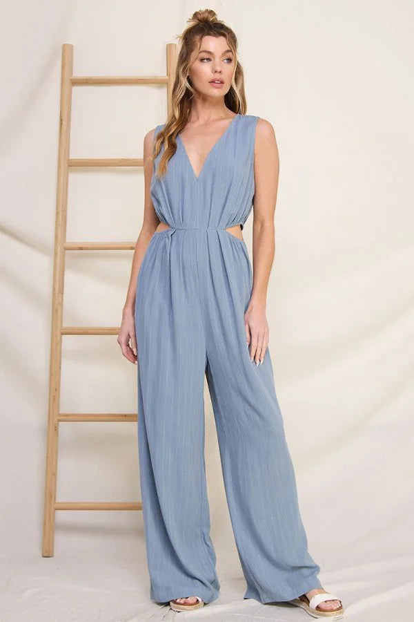 Light blue pinstriped linen V-neck jumpsuit with flowy wide-leg pants