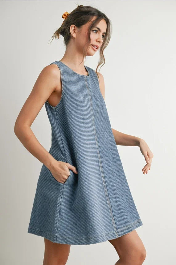 Light blue striped sleeveless denim mini dress with side pockets for stylish summer wear