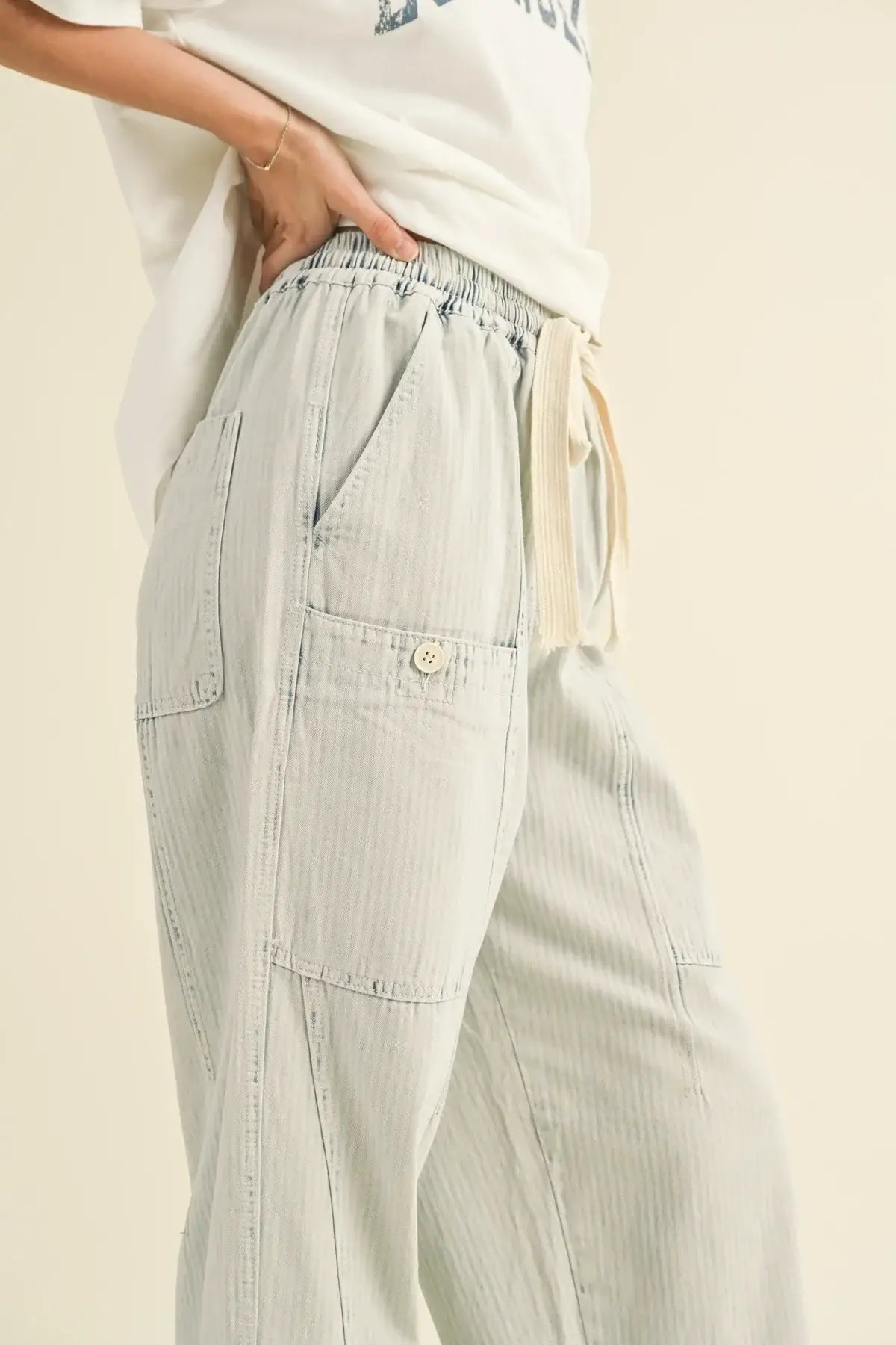 Light blue striped washed barrel shape pants with pockets and cargo style design
