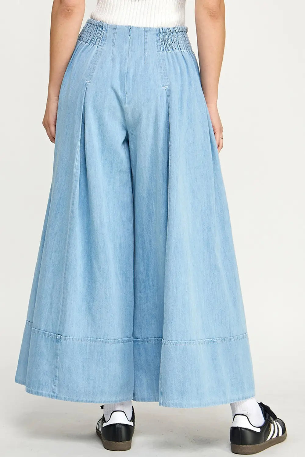 Light blue wide leg denim pants showcasing women’s boho chic clothing style